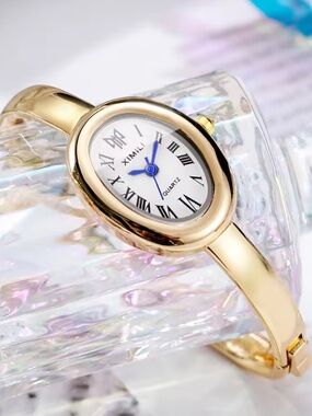 Anthropologie Gold Oval Bangle Watch with White Dial and Blue Hands